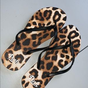 Pink cheetah print flip flops